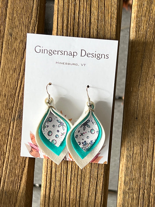 Small curved teal & white holiday snowflakes